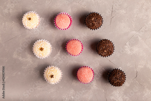 Table with brigadeiro and various party sweets. photo