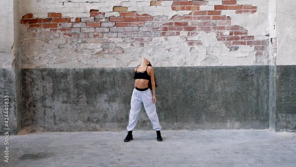 Female dancer performing in urban street Female dancer performing in urban street