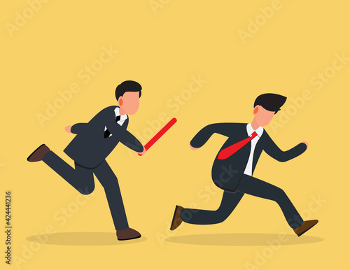Teamwork and Cooperation concept. Two businessman passed from hand to hand relay baton.