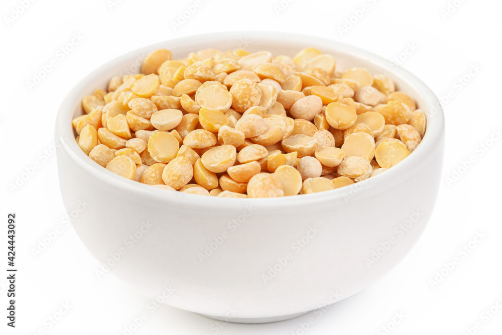 Raw dried uncooked pea beans with ceramic bowl on white background macro Raw dried uncooked pea beans with ceramic bowl on white background macro