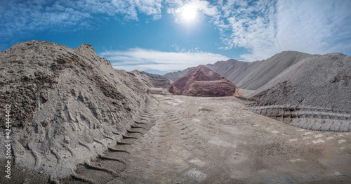 Piles of multicolored granite gravel in production