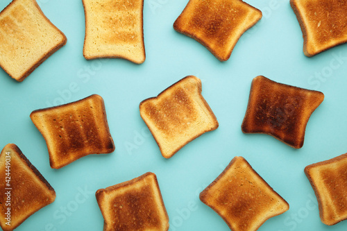 Slices of toast bread on blue background