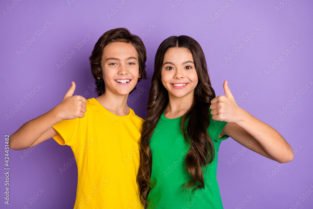 Photo of young two kids happy positive smile show thumb-up like cool perfect ideal suggest isolated over purple color background Photo of young two kids happy positive smile show thumb-up like cool perfect ideal suggest isolated over purple color background