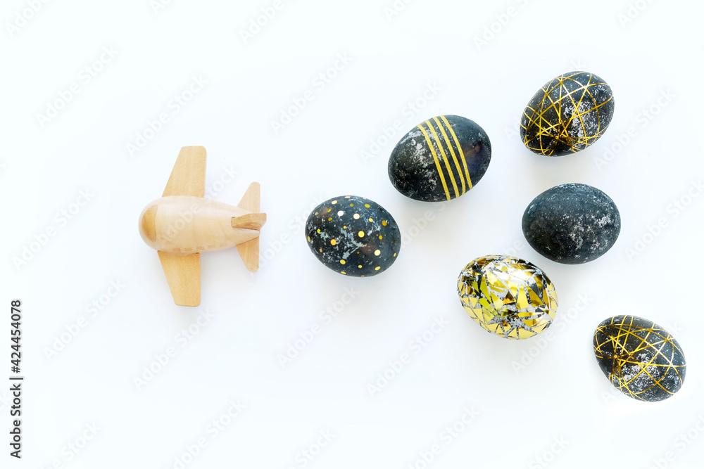 Black easter eggs with gold pattern and pink flowers Black easter eggs with gold pattern and pink flowers