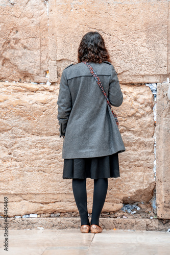 Young jewish girl prays at the Wailing Wall. Jerusalem, Israel (581) photo