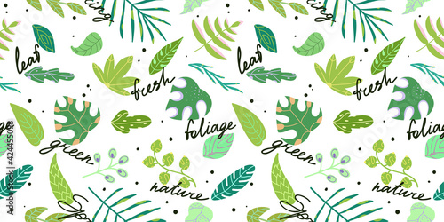 Seamless pattern with various green leaves lettering and words.Spring fresh print in cartoon style.Pattern of tropical decorative foliage on a white background.
