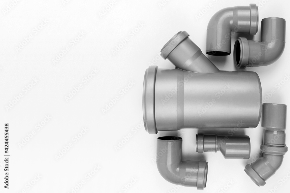 PVC plastic water pipes in gray color, insulated on a white background