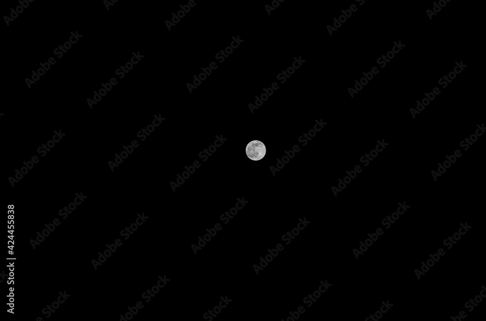 Full moon on dark night. Satellite of the Earth in the black firmament. Full moon on dark night. Satellite of the Earth in the black firmament.