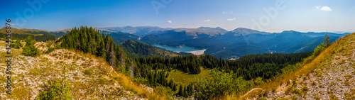 Outstanding view of Ialomita Valley and Bucegi Mountains from Podu cu Florile, Bolboci lake, Padina Pestera Resort, Dambovita County, Romania © unbolovan
