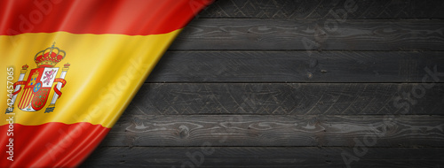 Spanish flag on black wood wall banner