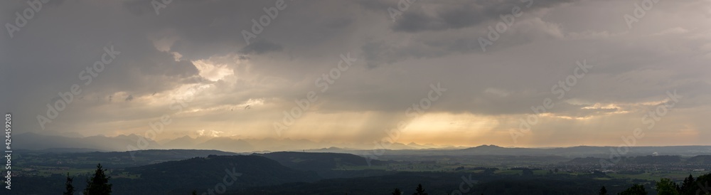 travel germany and bavaria, view over bavarian landscape while weather is changing from sun to rain