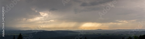 travel germany and bavaria  view over bavarian landscape while weather is changing from sun to rain