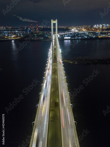 South automobile bridge in Kiev. Night illumination of the bridge. Aerial drone view.