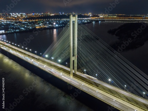 South automobile bridge in Kiev. Night illumination of the bridge. Aerial drone view.