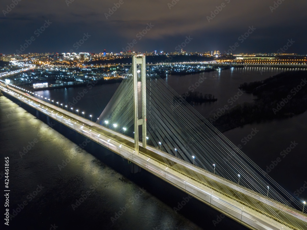 Obraz premium South automobile bridge in Kiev. Night illumination of the bridge. Aerial drone view.