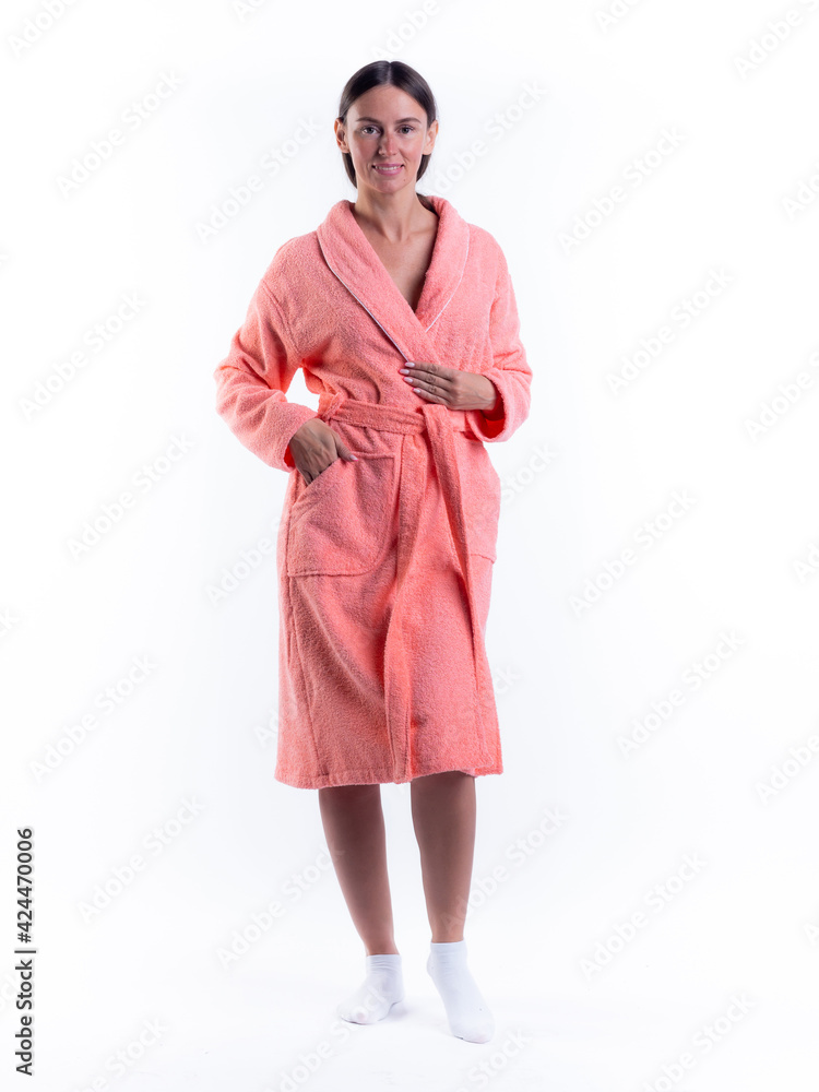 woman in a Bathrobe on an isolated white background with a smile on her face. woman in a Bathrobe on an isolated white background with a smile on her face.
