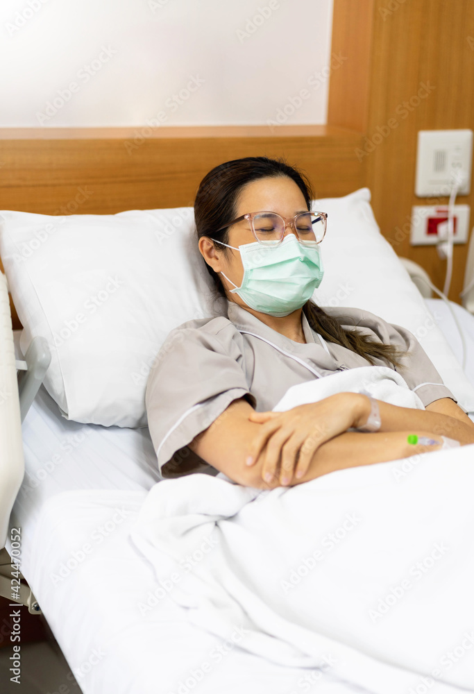 Asian young female patients lying in the room. hospital background. Asian young female patients lying in the room. hospital background.