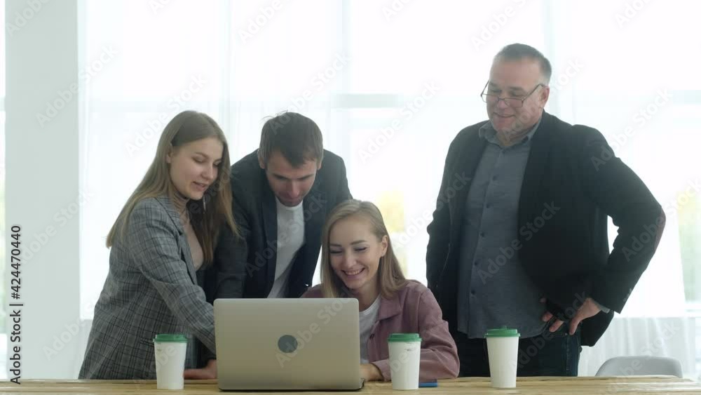 Creative group of men and women work in office. team discusses development of business and startup strategy. Brainstorming young employees of company in spacious office with director of the boss. Creative group of men and women work in office. team discusses development of business and startup strategy. Brainstorming young employees of company in spacious office with director of the boss.