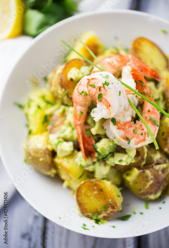 Potato salad with avocado and prawns