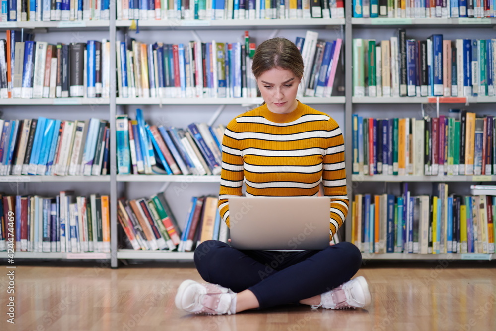 the student uses a notebook and a school library the student uses a notebook and a school library