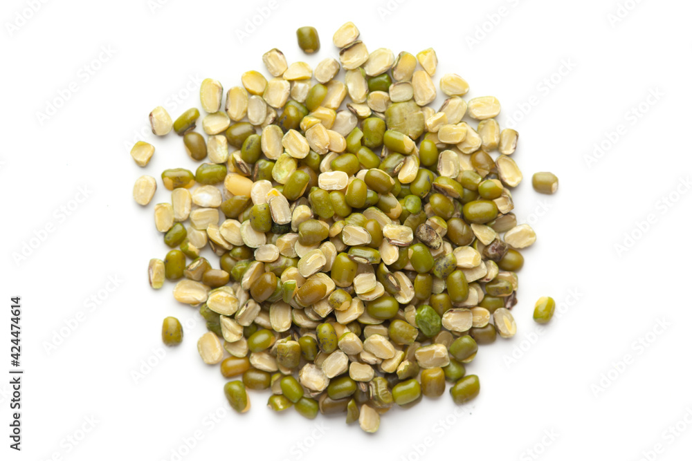 macro Close-up of Organic green Gram (Vigna radiata) or spilt green moong dal unpolished cleaned on a white background. Top view macro Close-up of Organic green Gram (Vigna radiata) or spilt green moong dal unpolished cleaned on a white background. Top view