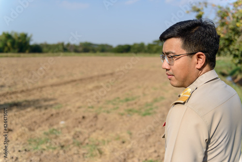A Thai government official works outside the office, to explore the farming areas of the villagers.