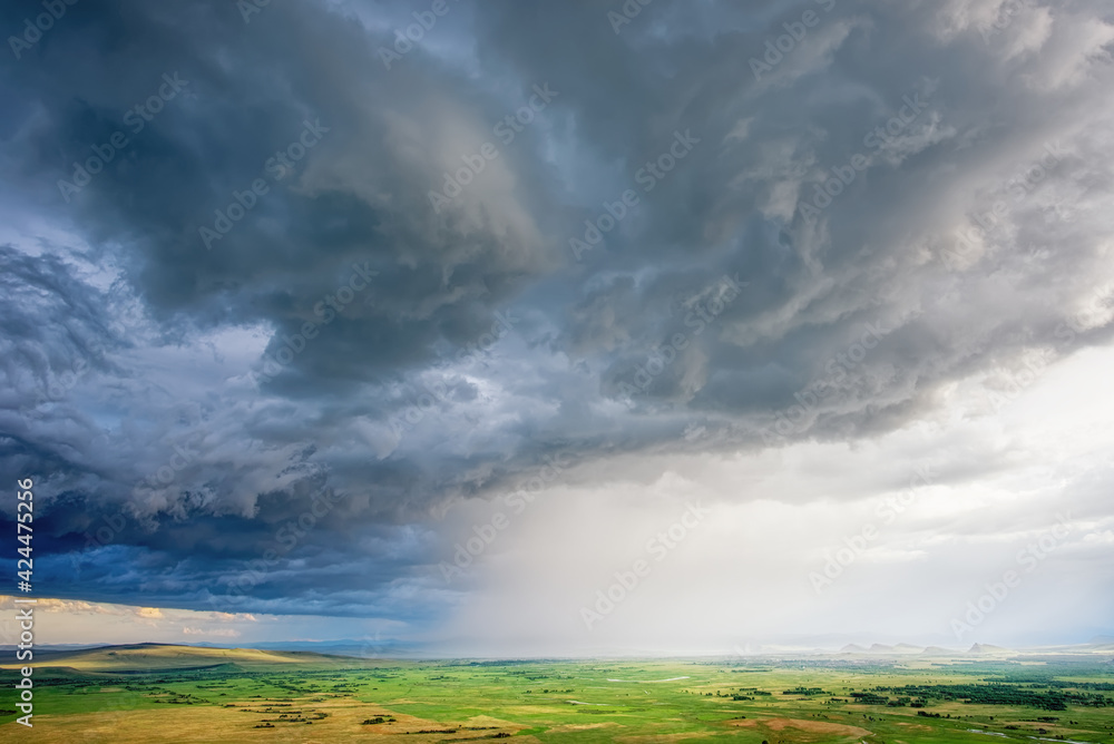 Thunderstorm with clouds and rains over the steppes and mountains of Khakassia park chests