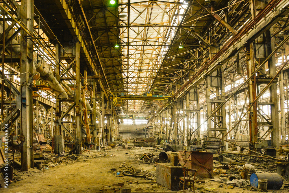 An old abandoned industrial workshop after metallurgical production . The concept of ruin, defeat, failure, failure .