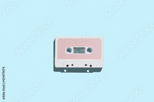 Audio cassette. Vintage white audio cassette tap on colored background. Old cassette tape audio isolated on white.