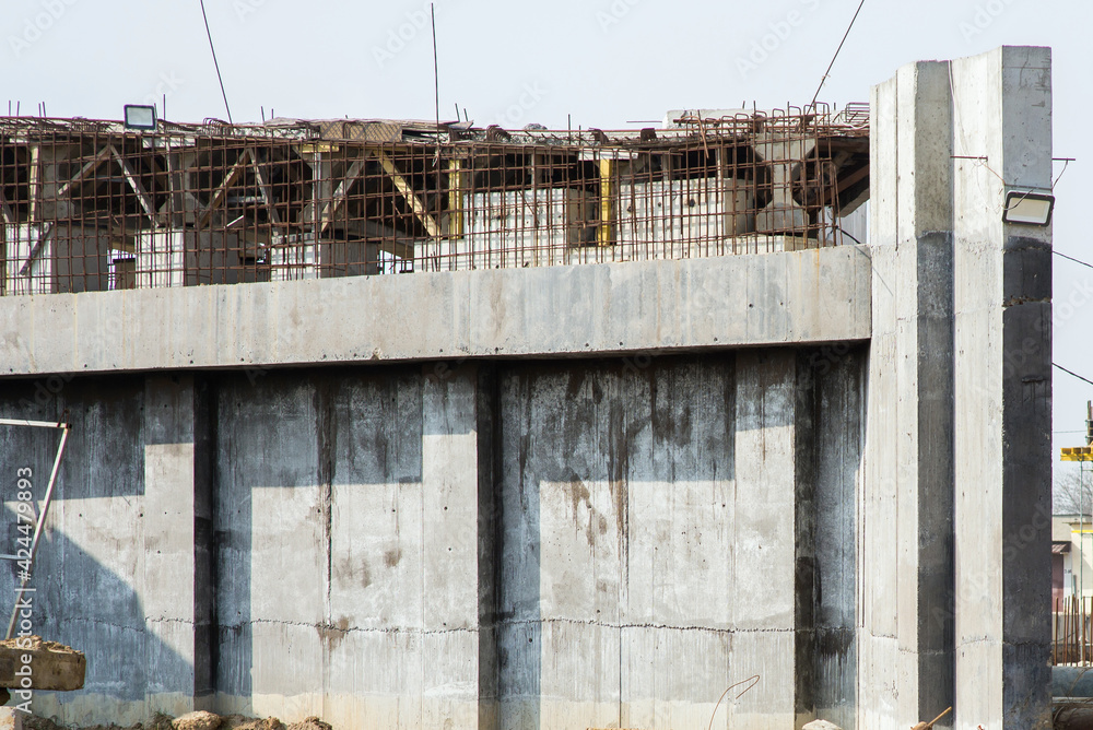 Close-up of a new concrete structure with reinforcement in the process of construction at a construction site Close-up of a new concrete structure with reinforcement in the process of construction at a construction site