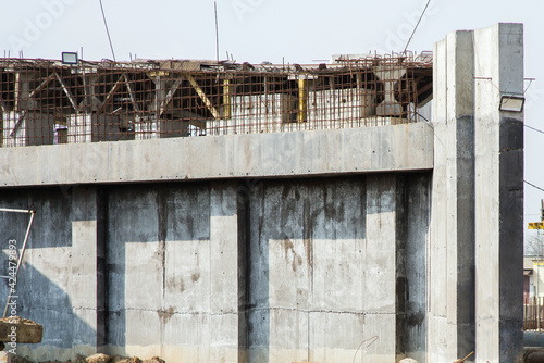 Close-up of a new concrete structure with reinforcement in the process of construction at a construction site