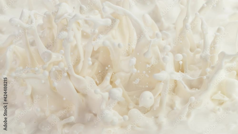 Super slow motion of waving milk liquid in macro shot. Filmed on high speed cinema camera, 1000fps. Super slow motion of waving milk liquid in macro shot. Filmed on high speed cinema camera, 1000fps.