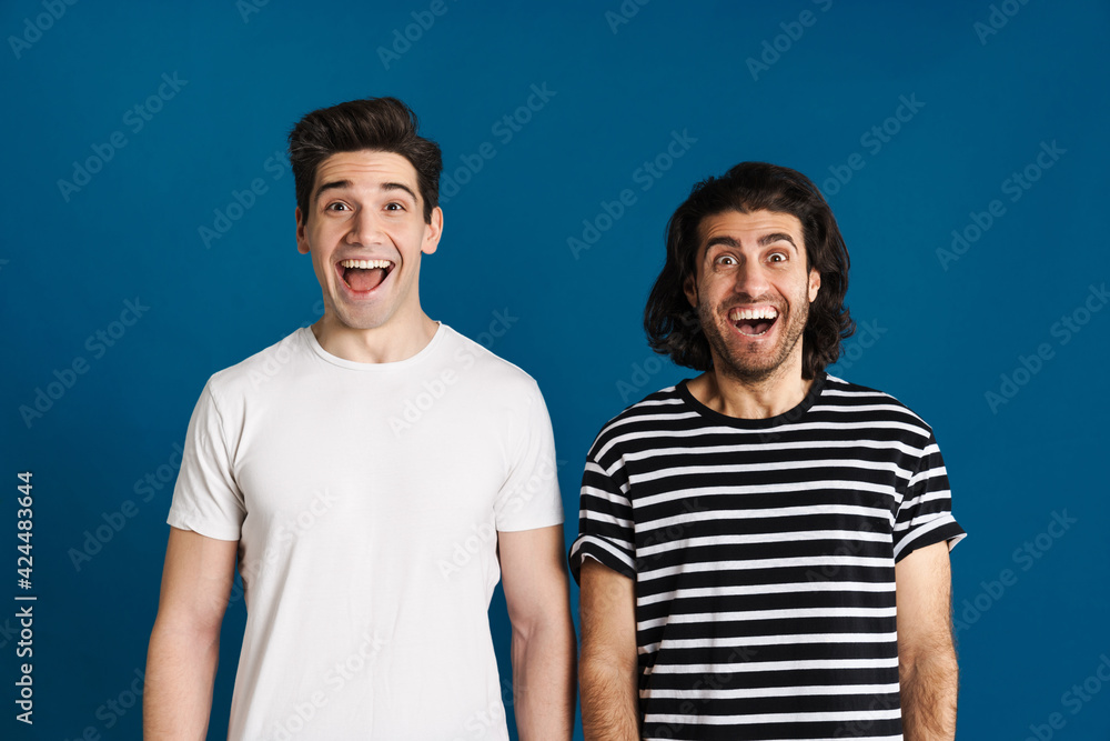 White excited two men exclaiming and looking at camera White excited two men exclaiming and looking at camera