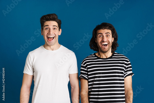 White excited two men exclaiming and looking at camera