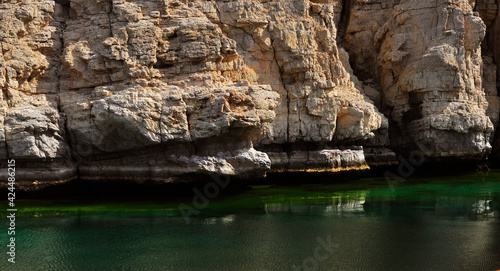 deep green sea (Oman bay) with the rocks in Khasab