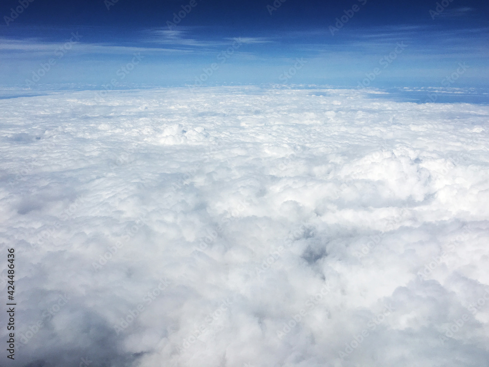 Naklejka premium view of clouds over the clouds from the plane
