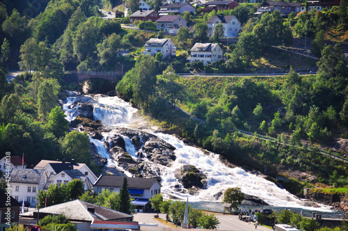 Waterfall in the town Geiranger, Norway photo