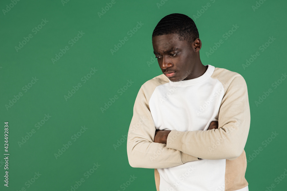 African man's portrait isolated on green studio background with copyspace African man's portrait isolated on green studio background with copyspace