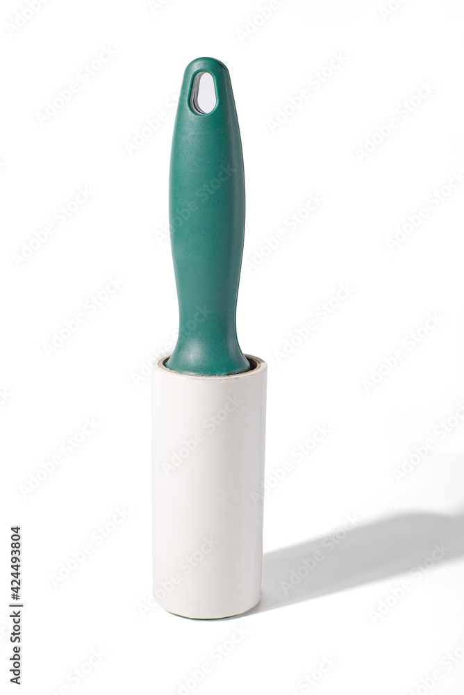 Roller for cleaning clothes from wool, pet hair on clothes isolated on a white background with shadow Roller for cleaning clothes from wool, pet hair on clothes isolated on a white background with shadow