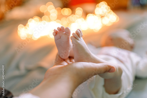 Mummy holding baby s feet