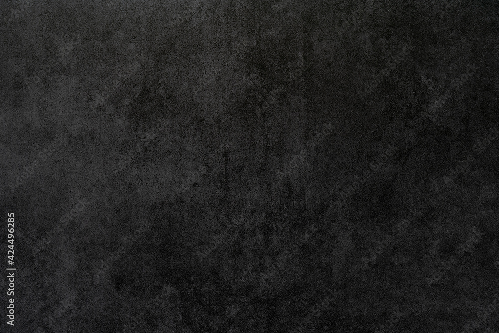 Black rough plaster wall texture. Abstract design background.