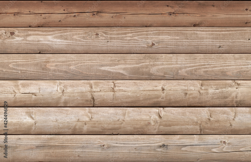 Wooden wall made of logs, background texture Wooden wall made of logs, background texture