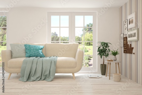 White living room with sofa and summer landscape in window. Scandinavian interior design. 3D illustration