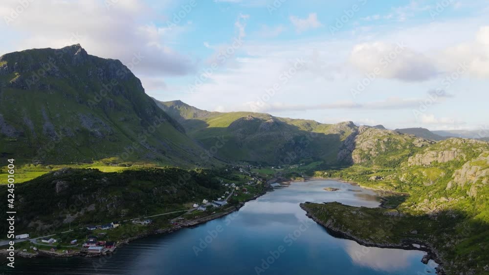Aerial drone shot overlooking a mountainside fisherman village, in Lofoten, Norway, during golden hour Aerial drone shot overlooking a mountainside fisherman village, in Lofoten, Norway, during golden hour