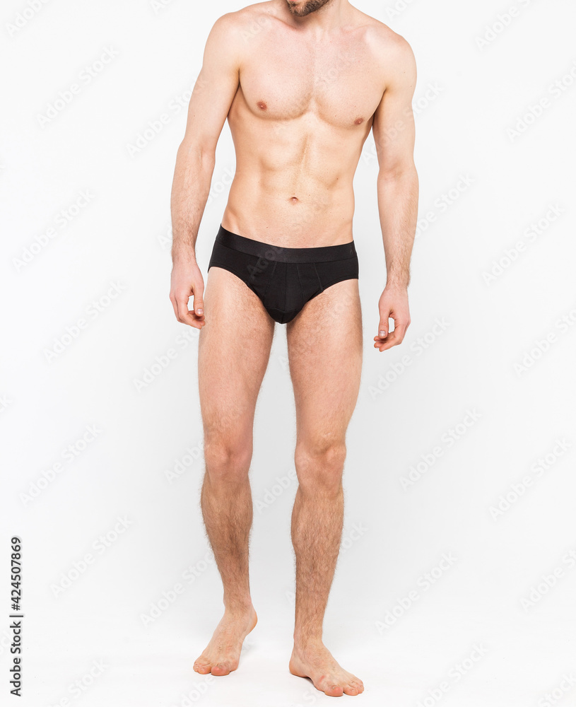 Muscular young man wearing underwear isolated on white background. Underwear for men copy space Muscular young man wearing underwear isolated on white background. Underwear for men copy space