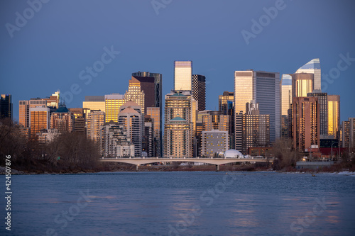 Calgary's skyline along the Bow River in the morning.