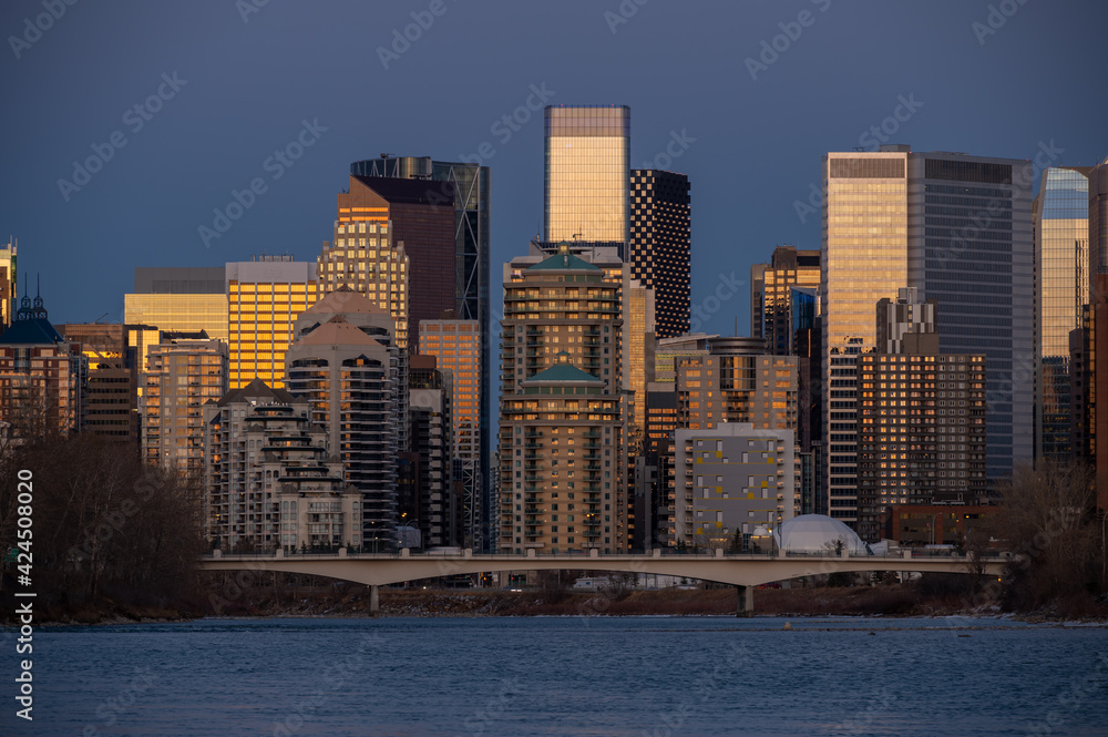 Calgary's skyline along the Bow River in the morning. Calgary's skyline along the Bow River in the morning.