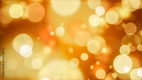Yellow orange honey gold abstract festive background. Glowing round particles. Blurry bokeh particles. Holiday, magic.