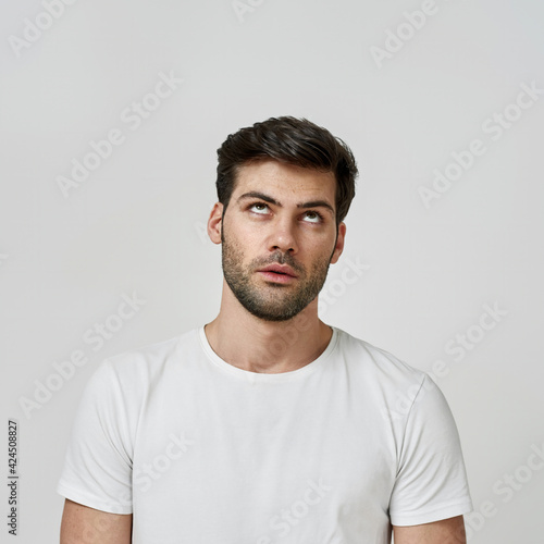 Man wearing t-shirt rolling his eyes