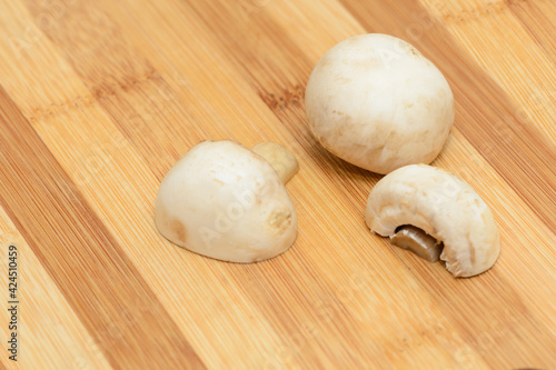 three slices of champignons on a cutting board